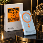 A light blue Pandaler Unicorn 15W portable power bank standing upright next to its white and orange retail box on a dark marble display surface with gold accents.