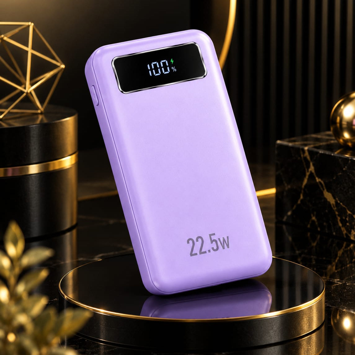 A lavender purple portable power bank with a digital display showing 100% battery and '22.5W' printed on the front, resting on a black circular platform with a gold rim in a dark, stylish setting.