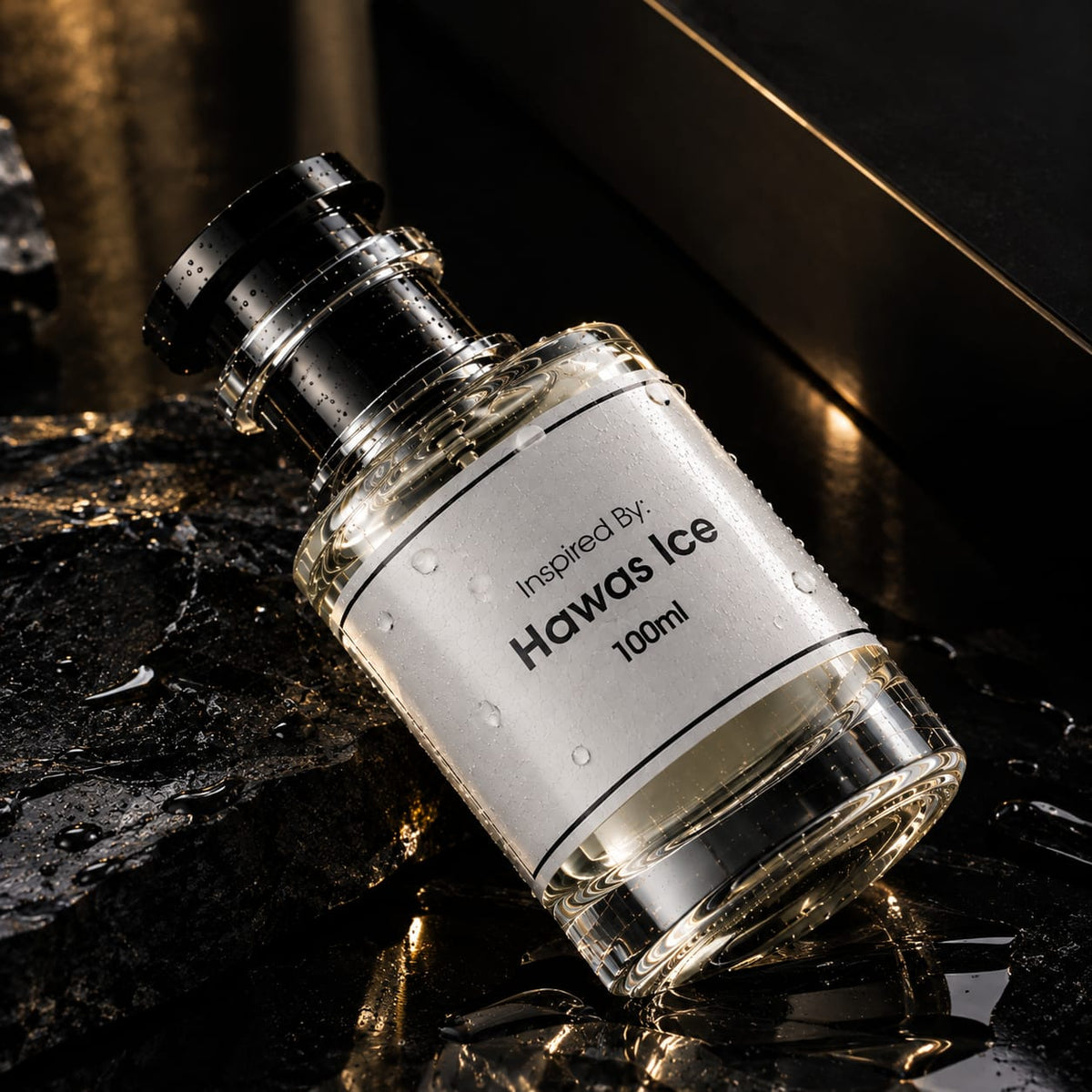 A 100ml glass bottle of fragrance with a black cap and a white label reading 'Inspired By: Hawas Ice', photographed on a dark reflective surface with water droplets.