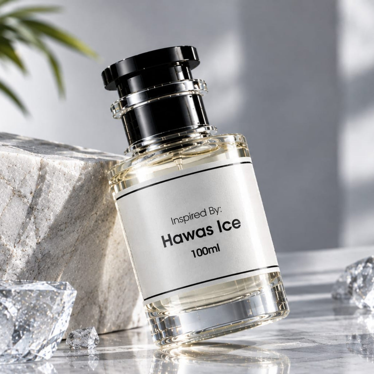 A 100ml glass perfume bottle labeled 'Inspired By Hawas Ice' with a black cap, styled on a marble surface with ice cubes and a stone block.