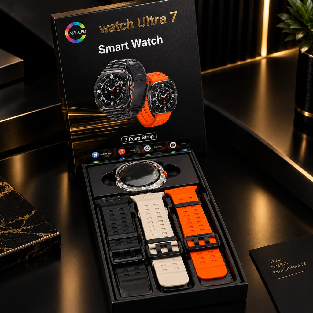 A boxed set of smart watch bands displayed open on a glossy black surface, with the retail box lid behind it showing a watch Ultra 7 Smart Watch graphic. The set includes multiple strap color options: black, white, and bright orange, along with black and clear protective cases.