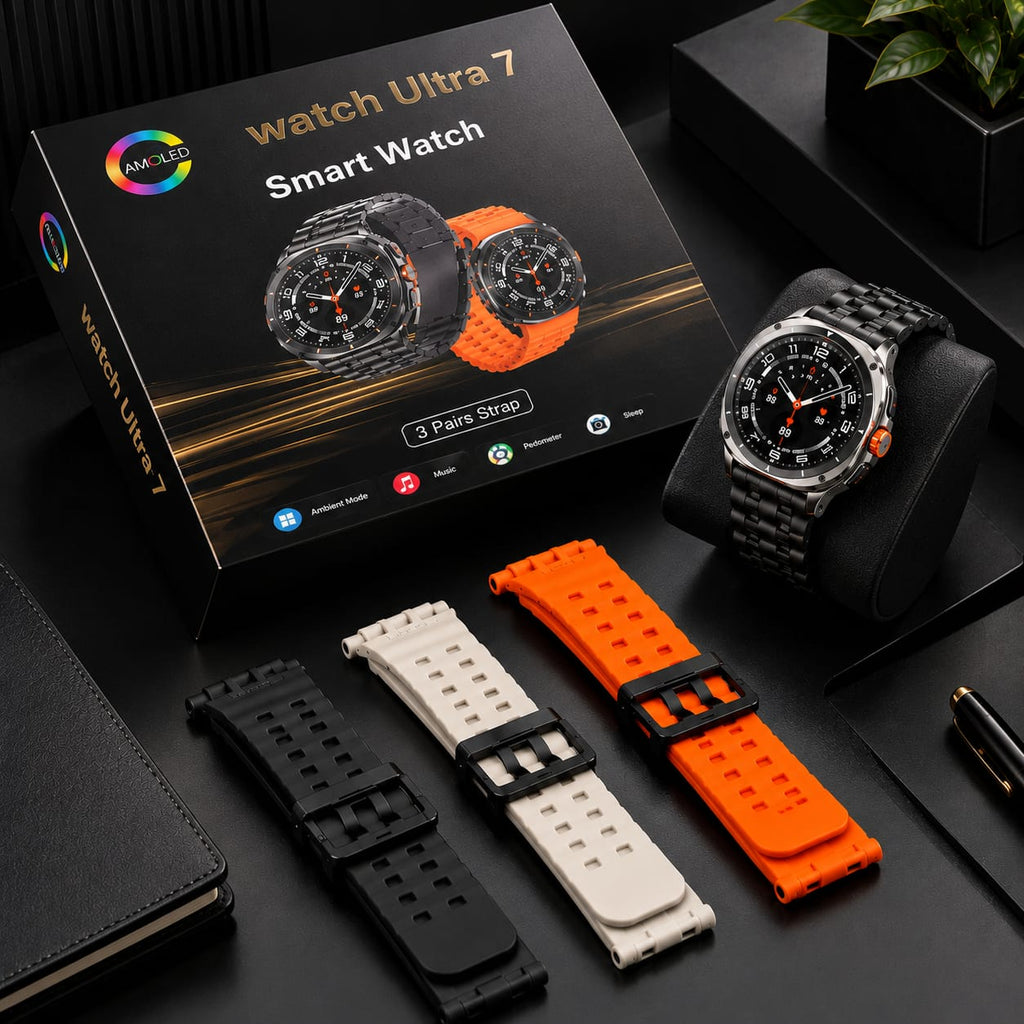 A smart watch displayed with its retail box, three interchangeable silicone straps in black, white, and orange, and a black watch stand on a dark tabletop.